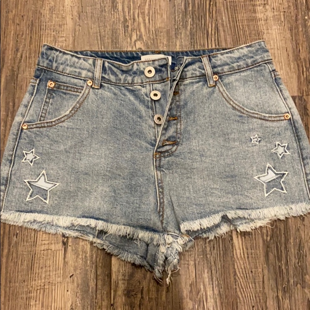 Denim shorts with star cut outs